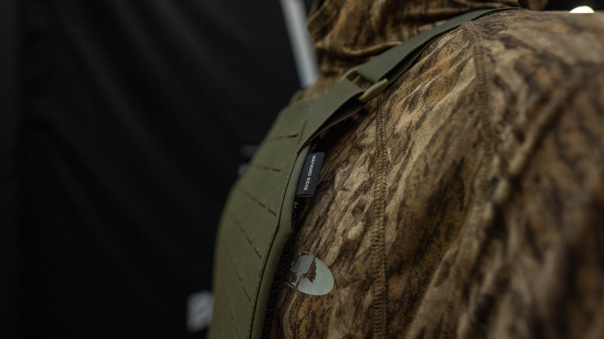The Detachment modular hunting chest rig by Wayward Ridge in Ranger Green, laser-cut MOLLE front
